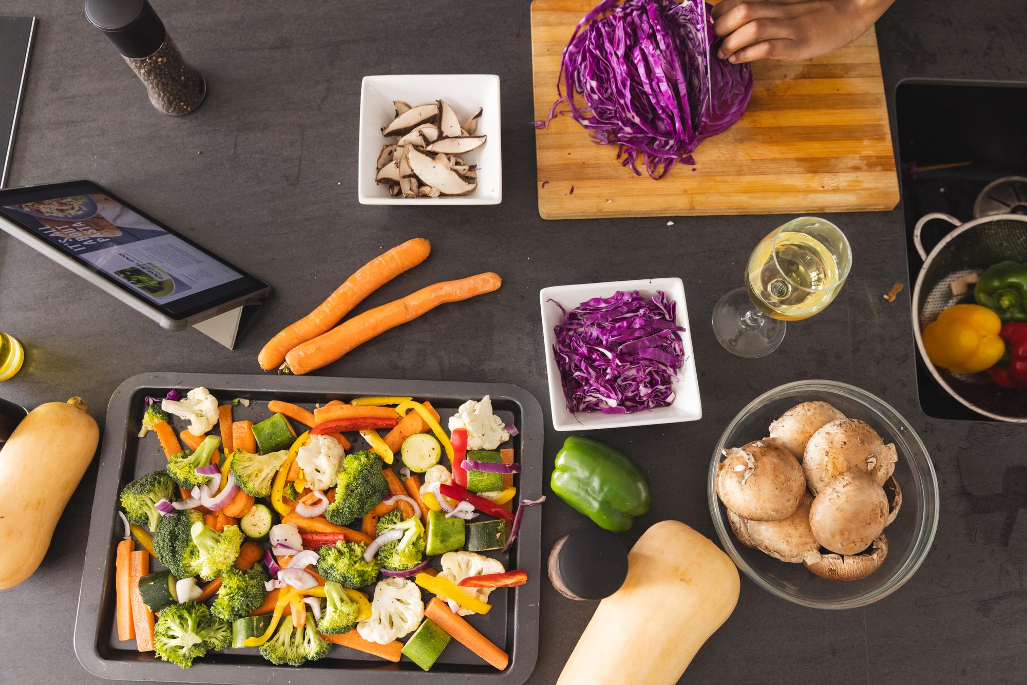 Overhead of prepared meal kit with ingredients on a wooden table
